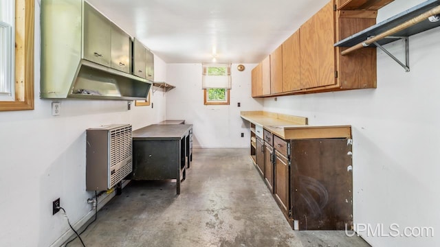 2600 S Hill Rd, Gladstone, MI 49837 - laundry area featuring heating unit