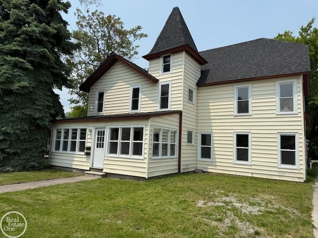 823 Beard St, Port Huron, MI 48060 - rear view of house with entry steps, a lawn, and a shingled roof