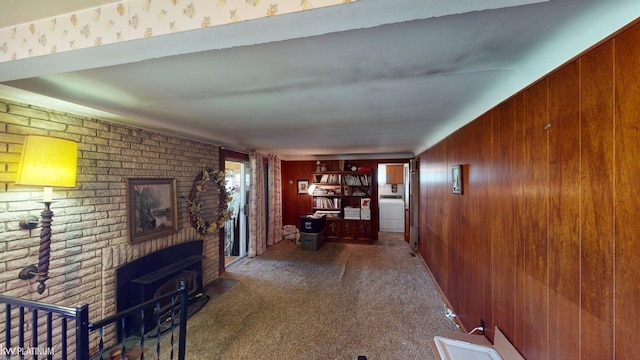 11493 Briarcliff Dr, Warren, MI 48093 - hallway with wooden walls, carpet, and brick wall