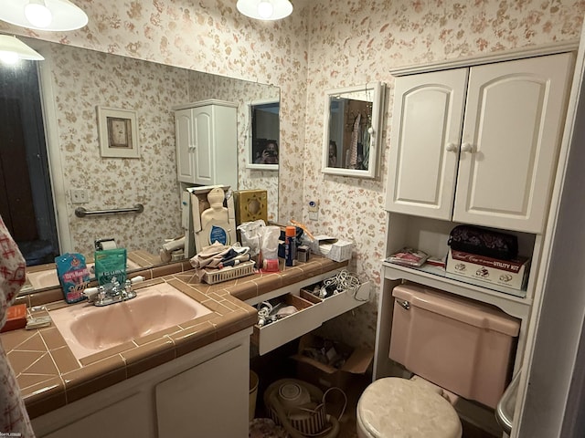 11493 Briarcliff Dr, Warren, MI 48093 - kitchen with tile countertops, a sink, white cabinets, and wallpapered walls