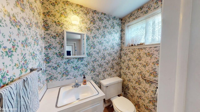 11493 Briarcliff Dr, Warren, MI 48093 - half bathroom featuring toilet, wallpapered walls, and vanity