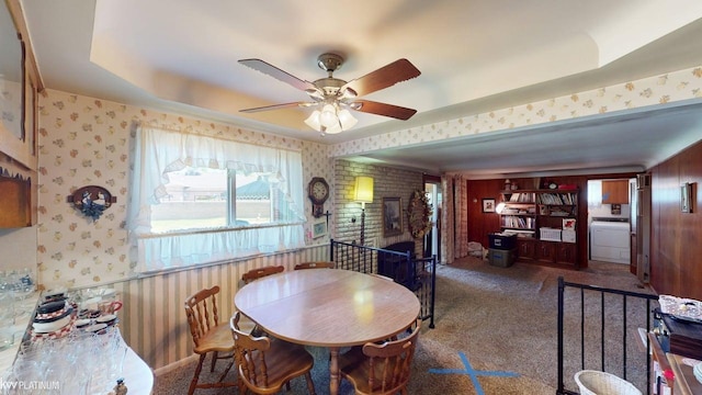 11493 Briarcliff Dr, Warren, MI 48093 - carpeted dining room featuring a fireplace, wallpapered walls, and a ceiling fan