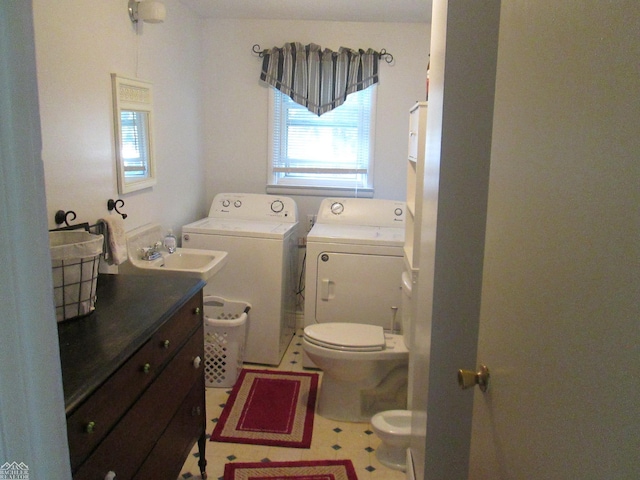 337 N 2nd St, Marine City, MI 48039 - bathroom with washer and dryer, toilet, a bidet, and vanity