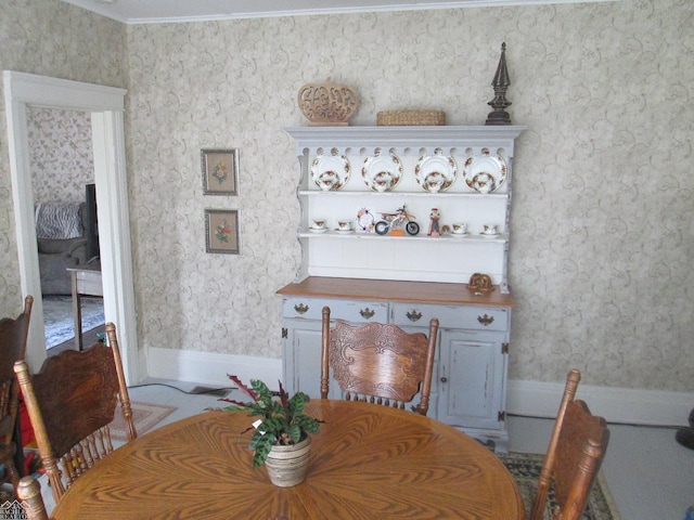 337 N 2nd St, Marine City, MI 48039 - dining area with wallpapered walls, ornamental molding, and baseboards