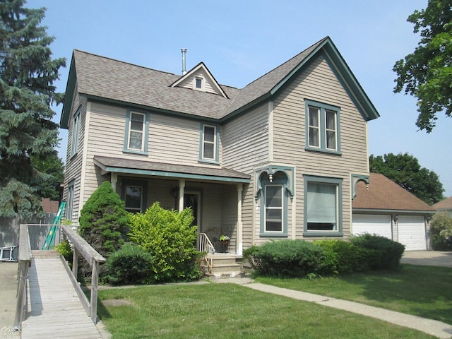 337 N 2nd St, Marine City, MI 48039 - view of front of property with a front lawn, a shingled roof, and a garage