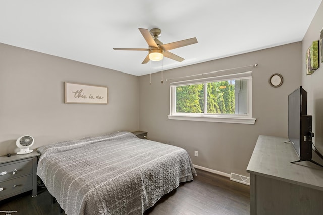 13040 Common Rd, Warren, MI 48088 - bedroom featuring baseboards, dark wood-style floors, and a ceiling fan