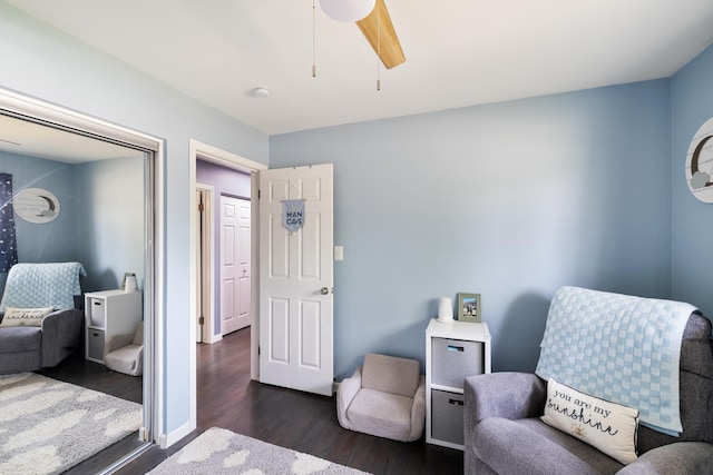 13040 Common Rd, Warren, MI 48088 - living area with dark wood finished floors, ceiling fan, and baseboards