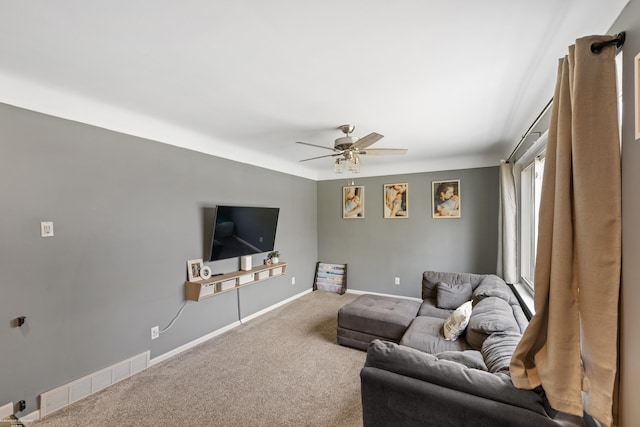 13040 Common Rd, Warren, MI 48088 - living room with carpet, a ceiling fan, and baseboards