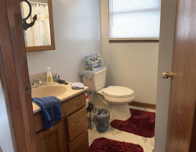 3045 W Lakeside Dr, West Branch, MI 48661 - bathroom featuring toilet and vanity