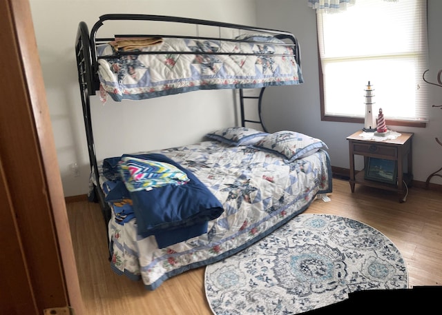 3045 W Lakeside Dr, West Branch, MI 48661 - bedroom with wood finished floors and baseboards
