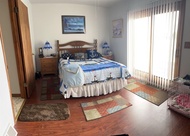 3045 W Lakeside Dr, West Branch, MI 48661 - bedroom featuring wood finished floors