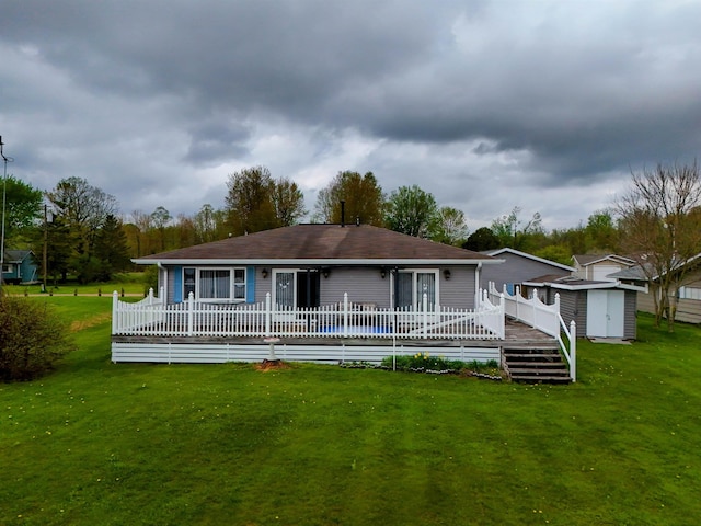 3045 W Lakeside Dr, West Branch, MI 48661 - rear view of house featuring a wooden deck and a lawn