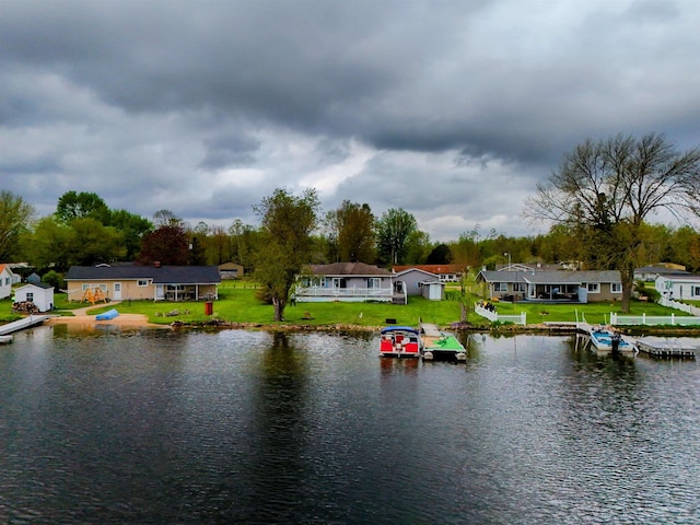 3045 W Lakeside Dr, West Branch, MI 48661 - water view with a boat dock and nearby suburban area