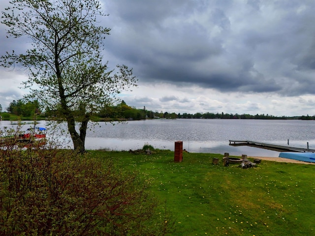 3045 W Lakeside Dr, West Branch, MI 48661 - water view featuring a dock