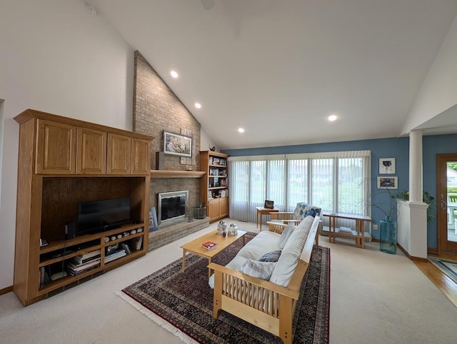 5663 Macintosh Dr, Bay City, MI 48706 - living room featuring light colored carpet, ornate columns, high vaulted ceiling, a brick fireplace, and recessed lighting