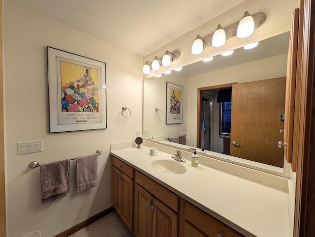 5663 Macintosh Dr, Bay City, MI 48706 - bathroom with vanity, tile patterned flooring, and baseboards