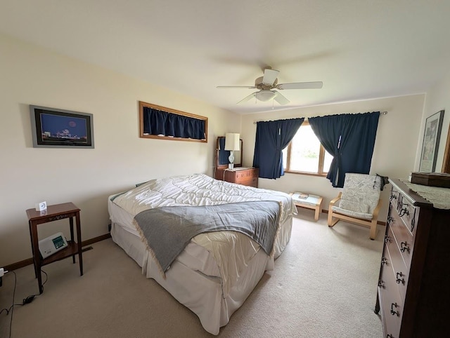 5663 Macintosh Dr, Bay City, MI 48706 - bedroom with light colored carpet, ceiling fan, and baseboards