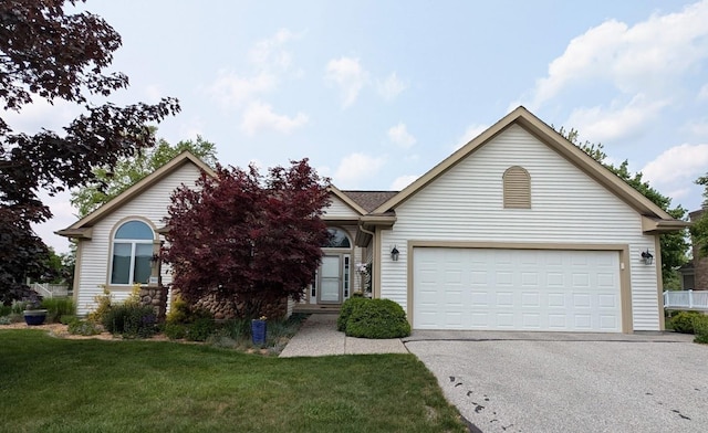 5663 Macintosh Dr, Bay City, MI 48706 - view of front of property with asphalt driveway, a front lawn, and a garage