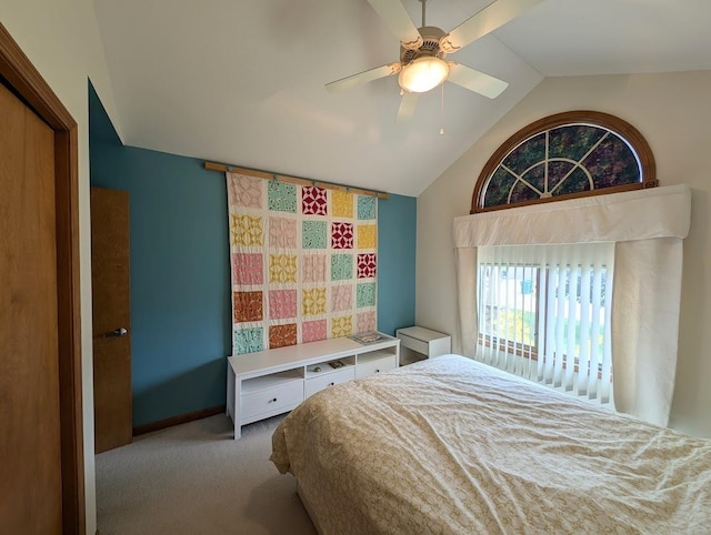 5663 Macintosh Dr, Bay City, MI 48706 - carpeted bedroom with vaulted ceiling, a ceiling fan, and baseboards