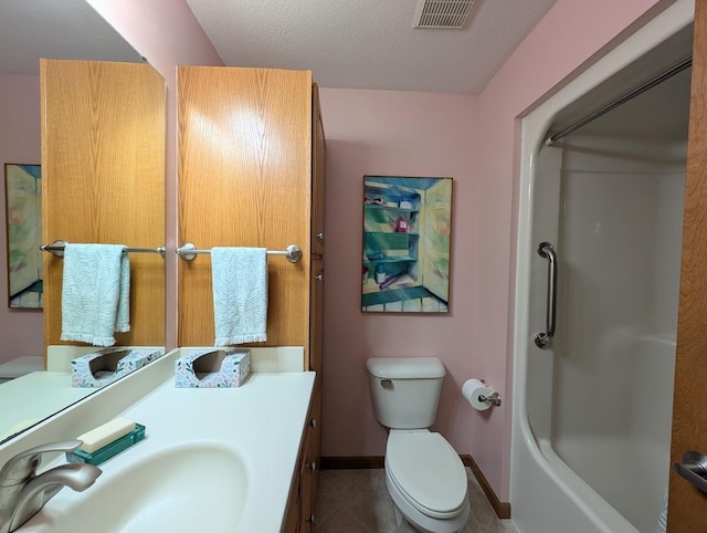5663 Macintosh Dr, Bay City, MI 48706 - full bathroom featuring vanity, toilet, a textured ceiling, tile patterned floors, and baseboards