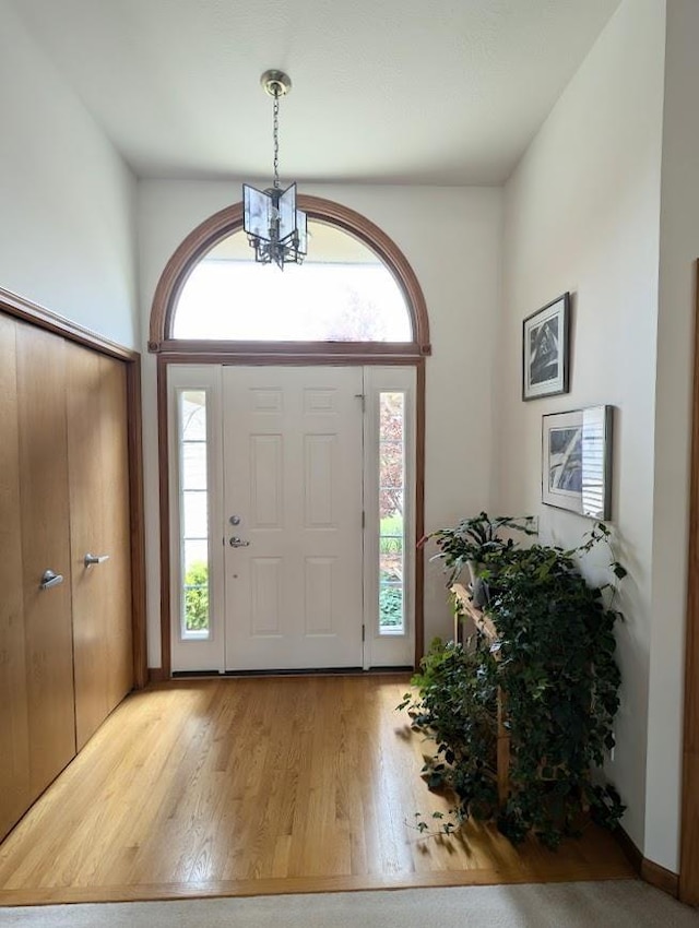 5663 Macintosh Dr, Bay City, MI 48706 - entryway with wood finished floors and a chandelier