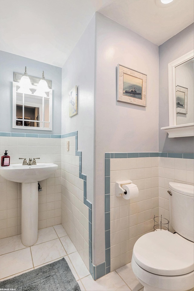 33473 Mulvey Rd, Fraser, MI 48026 - bathroom with tile walls, toilet, tile patterned flooring, and wainscoting