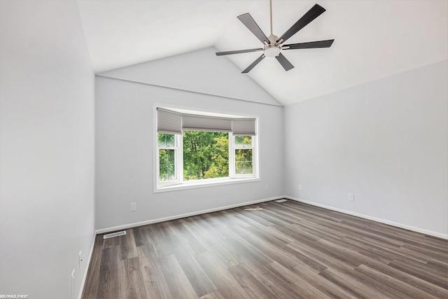 33473 Mulvey Rd, Fraser, MI 48026 - unfurnished room featuring lofted ceiling, a ceiling fan, dark wood-type flooring, and baseboards