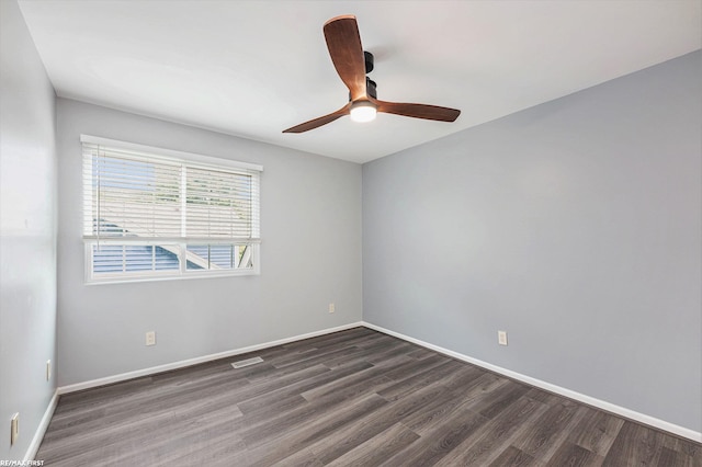 33473 Mulvey Rd, Fraser, MI 48026 - spare room with dark wood-style floors, ceiling fan, and baseboards