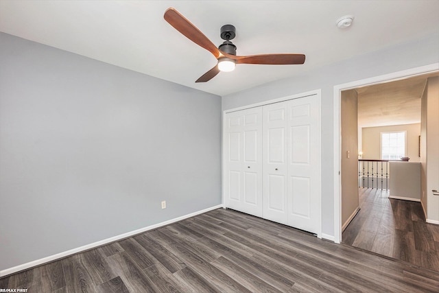 33473 Mulvey Rd, Fraser, MI 48026 - unfurnished bedroom featuring dark wood-type flooring, a closet, baseboards, and ceiling fan
