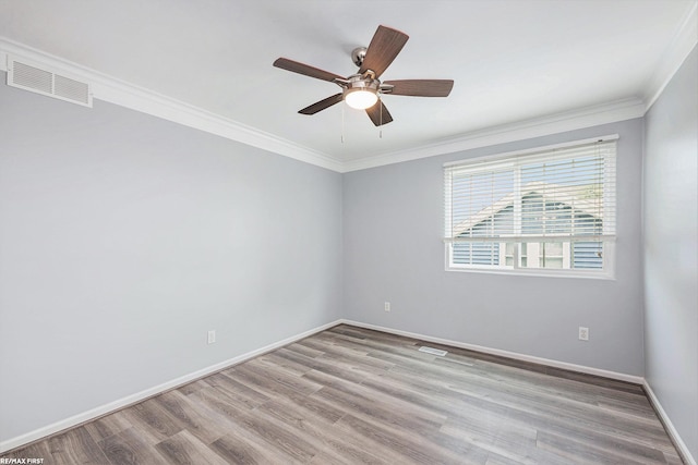 33473 Mulvey Rd, Fraser, MI 48026 - spare room featuring wood finished floors, ornamental molding, baseboards, and ceiling fan