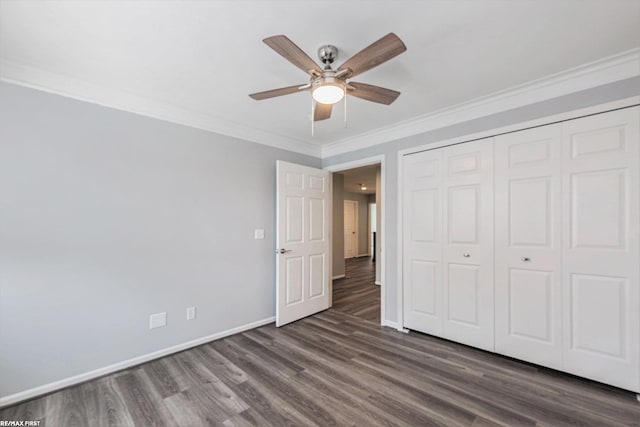 33473 Mulvey Rd, Fraser, MI 48026 - unfurnished bedroom with dark wood-style flooring, baseboards, ornamental molding, a closet, and ceiling fan
