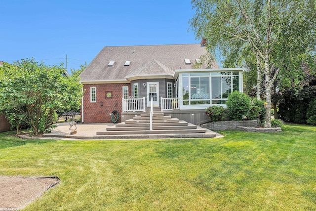 33473 Mulvey Rd, Fraser, MI 48026 - back of house featuring a sunroom, a patio, brick siding, and roof with shingles