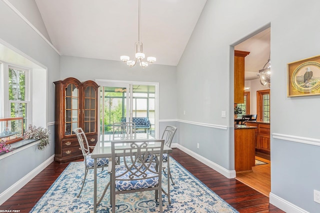 33473 Mulvey Rd, Fraser, MI 48026 - dining space with vaulted ceiling, dark wood finished floors, a chandelier, and healthy amount of natural light