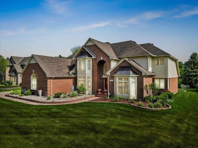 15158 Towering Oaks Dr, Shelby Twp, MI 48315 - traditional-style home with brick siding, a front yard, and a shingled roof