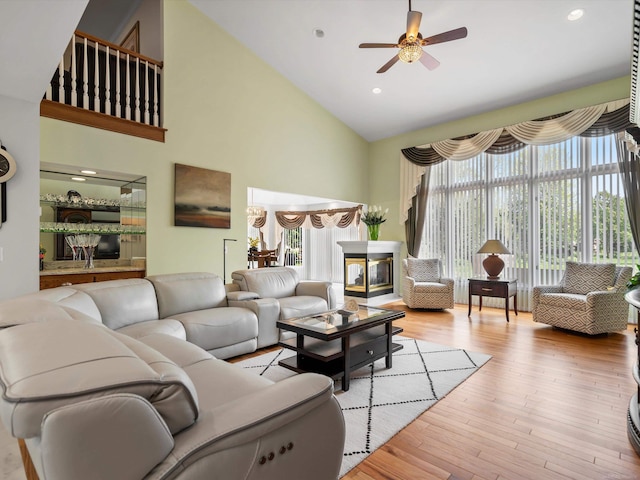 15158 Towering Oaks Dr, Shelby Twp, MI 48315 - living room with high vaulted ceiling, ceiling fan, wood finished floors, and recessed lighting