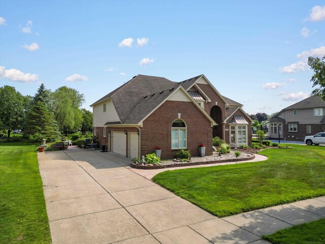 15158 Towering Oaks Dr, Shelby Twp, MI 48315 - view of front of home featuring brick siding, a front lawn, concrete driveway, and an attached garage