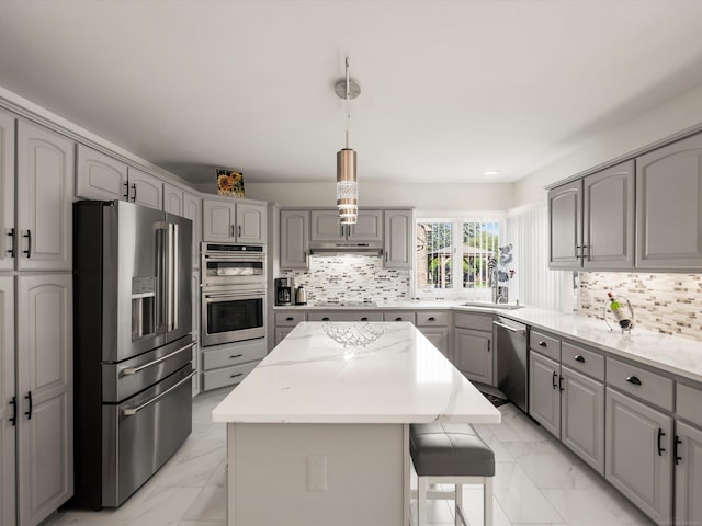 15158 Towering Oaks Dr, Shelby Twp, MI 48315 - kitchen with appliances with stainless steel finishes, gray cabinets, light marble finish floors, a center island, and a sink
