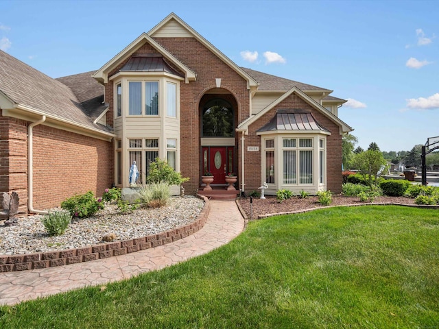 15158 Towering Oaks Dr, Shelby Twp, MI 48315 - view of front facade with a front lawn, brick siding, and roof with shingles