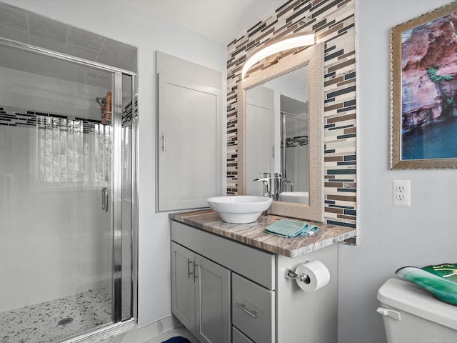 15158 Towering Oaks Dr, Shelby Twp, MI 48315 - bathroom with a shower stall, vanity, and toilet