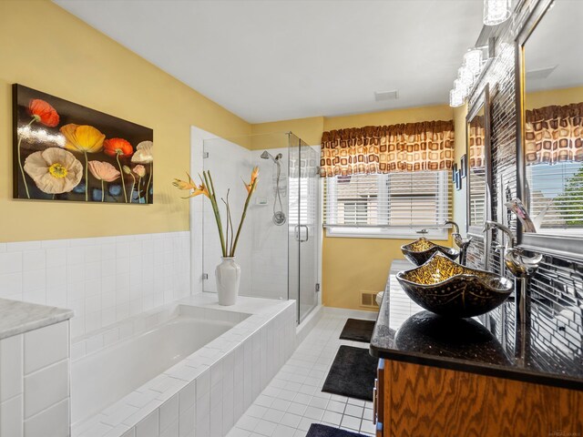15158 Towering Oaks Dr, Shelby Twp, MI 48315 - full bath with a bath, tile patterned flooring, vanity, a shower stall, and plenty of natural light