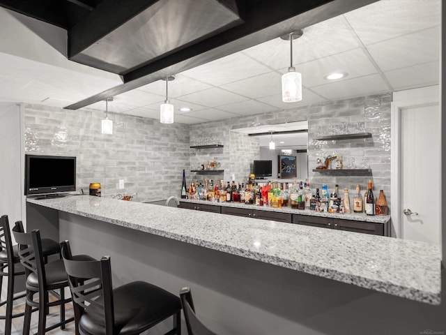 15158 Towering Oaks Dr, Shelby Twp, MI 48315 - indoor wet bar with a drop ceiling and pendant lighting