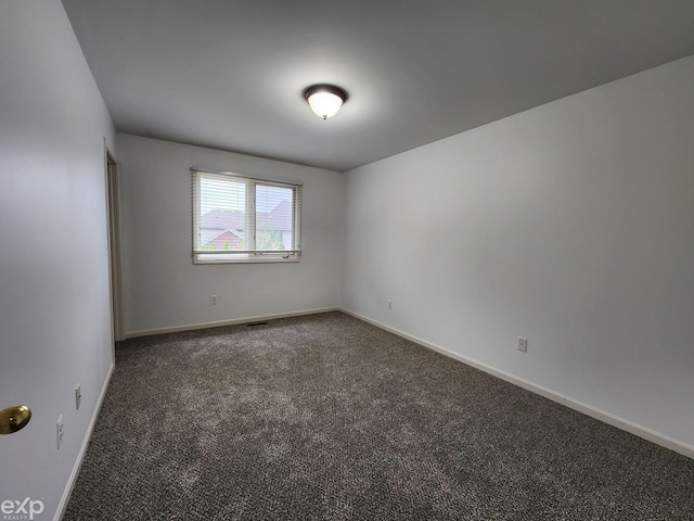 19913 Mapleton Dr, Macomb Twp, MI 48044 - empty room with carpet floors and baseboards