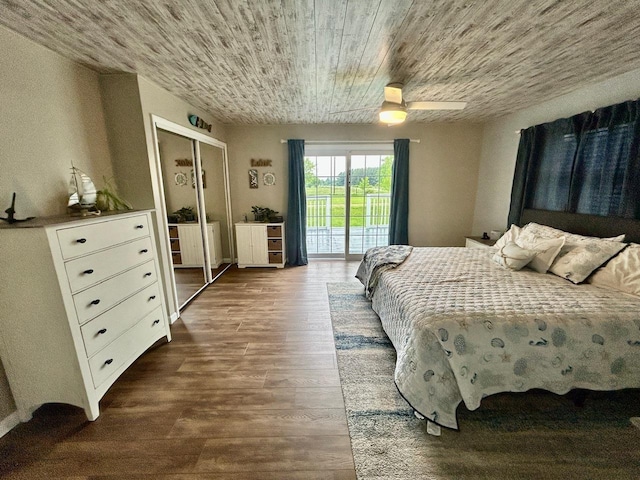 6586 N Coleman Rd, Coleman, MI 48618 - bedroom featuring access to outside, dark wood finished floors, a closet, wood ceiling, and a ceiling fan