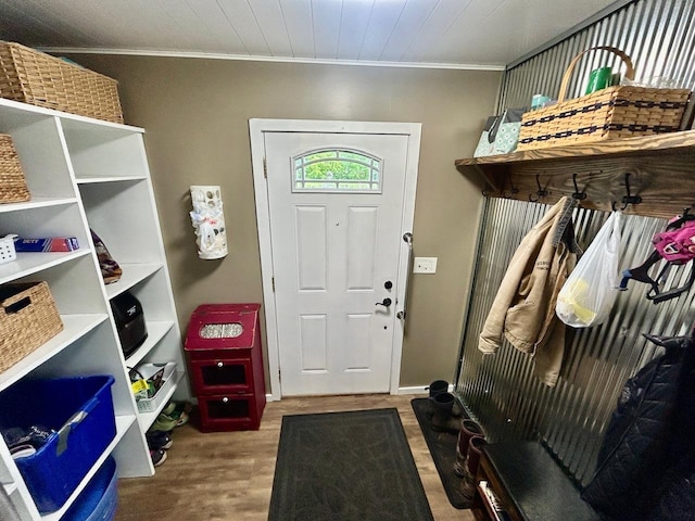 6586 N Coleman Rd, Coleman, MI 48618 - mudroom with wood finished floors and crown molding