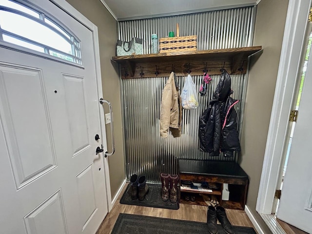 6586 N Coleman Rd, Coleman, MI 48618 - mudroom featuring wood finished floors and baseboards