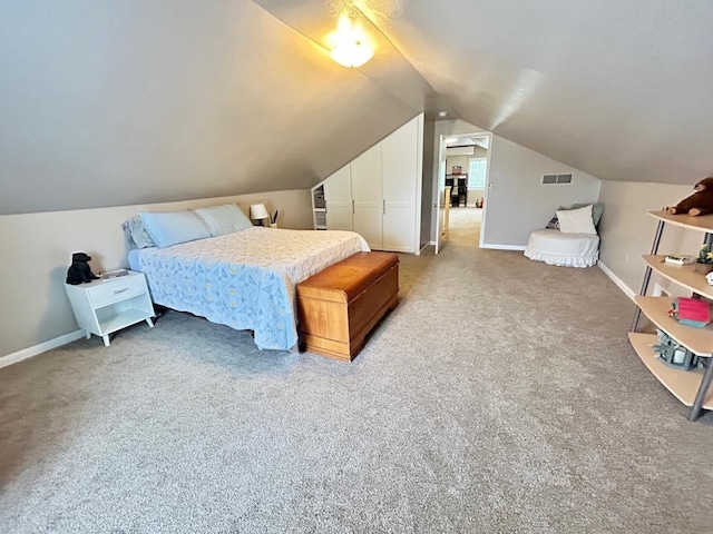 6586 N Coleman Rd, Coleman, MI 48618 - bedroom with lofted ceiling, carpet, and baseboards