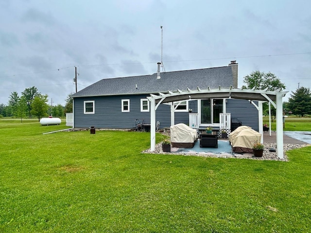 6586 N Coleman Rd, Coleman, MI 48618 - rear view of house with a patio, a pergola, a yard, and a chimney