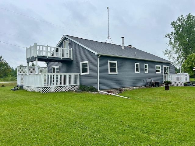 6586 N Coleman Rd, Coleman, MI 48618 - rear view of house with a lawn, a wooden deck, and a balcony