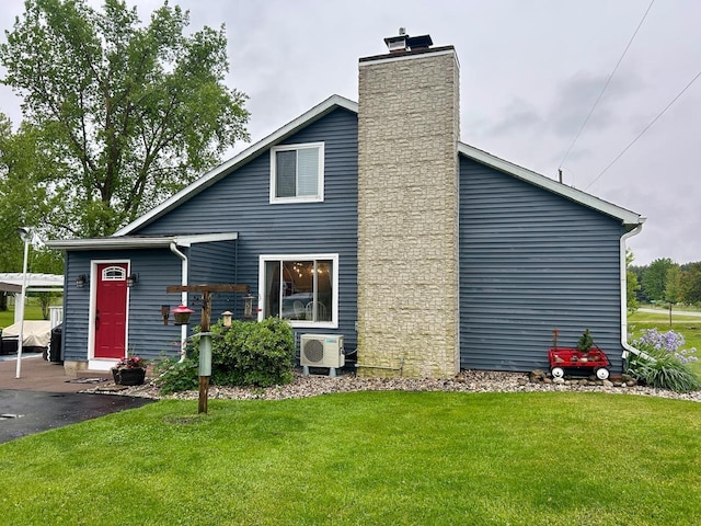 6586 N Coleman Rd, Coleman, MI 48618 - back of house with ac unit, a yard, and a chimney