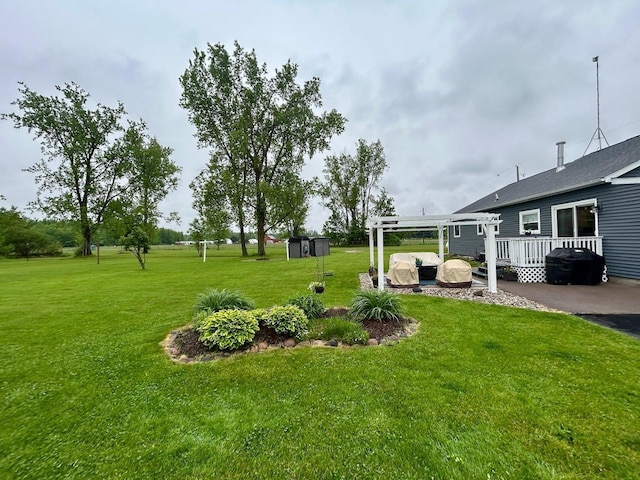 6586 N Coleman Rd, Coleman, MI 48618 - view of green lawn featuring a wooden deck